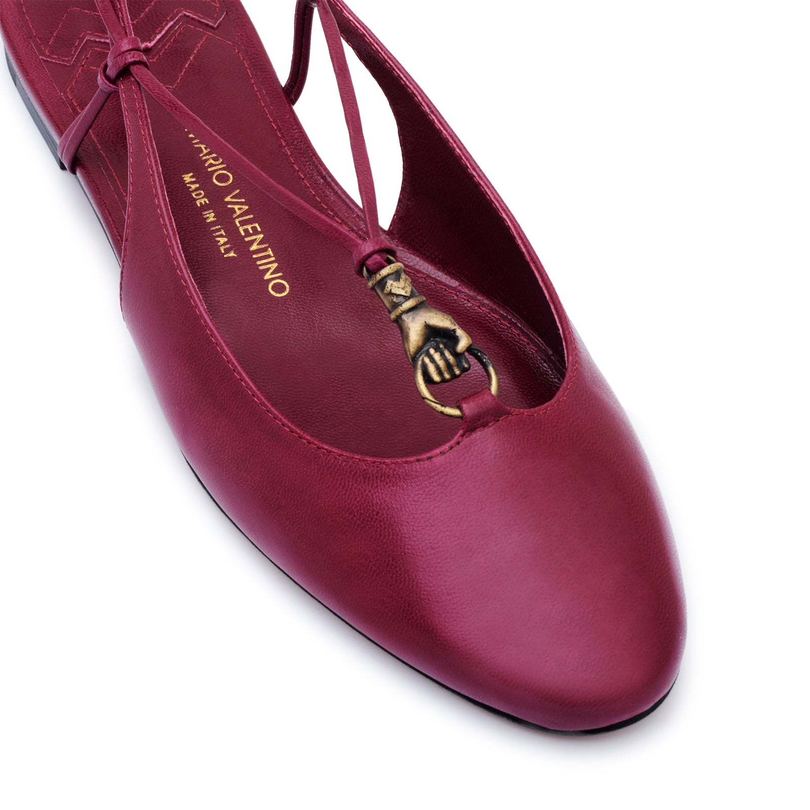 Mario Valentino burgundy round-toe kidskin leather slingback with 15mm heel, leather sole, ethnic-inspired gold embellishment, and signature embossed logo on the sole. Made in Italy