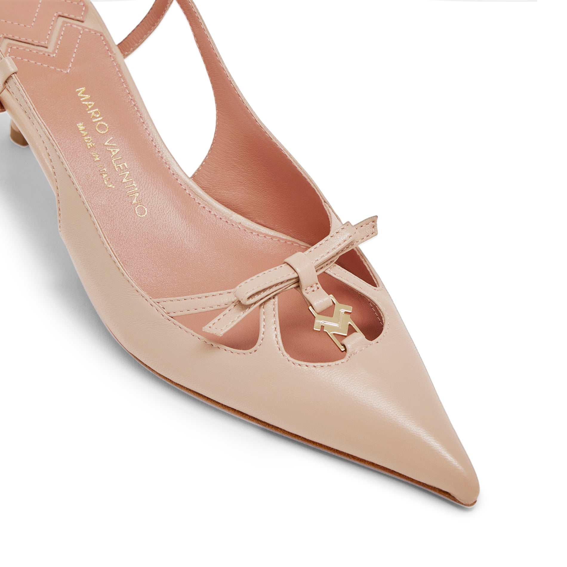 Close-up of leather bow detail and gold MV logo on Mario Valentino Cindy nude leather pointed toe slingback