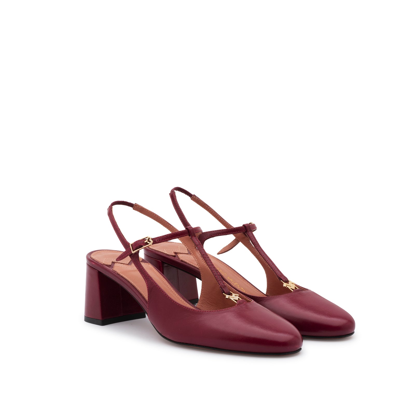 Mario Valentino burgundy T-bar block heel pumps featuring an adjustable ankle strap and elegant round toe. Made in Italy