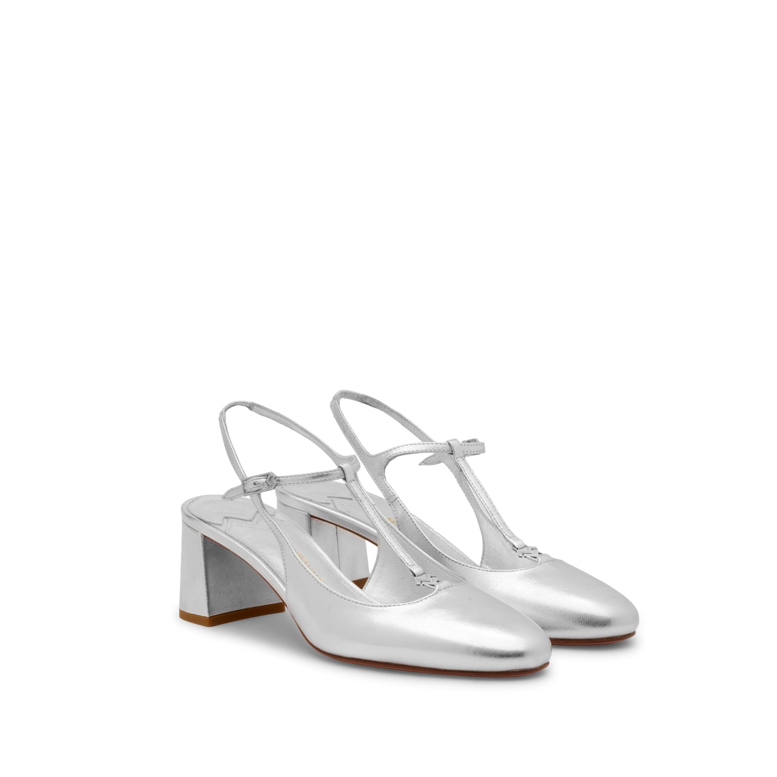 Mario Valentino silver T-bar block heel pumps featuring an adjustable ankle strap and elegant round toe. Made in Italy