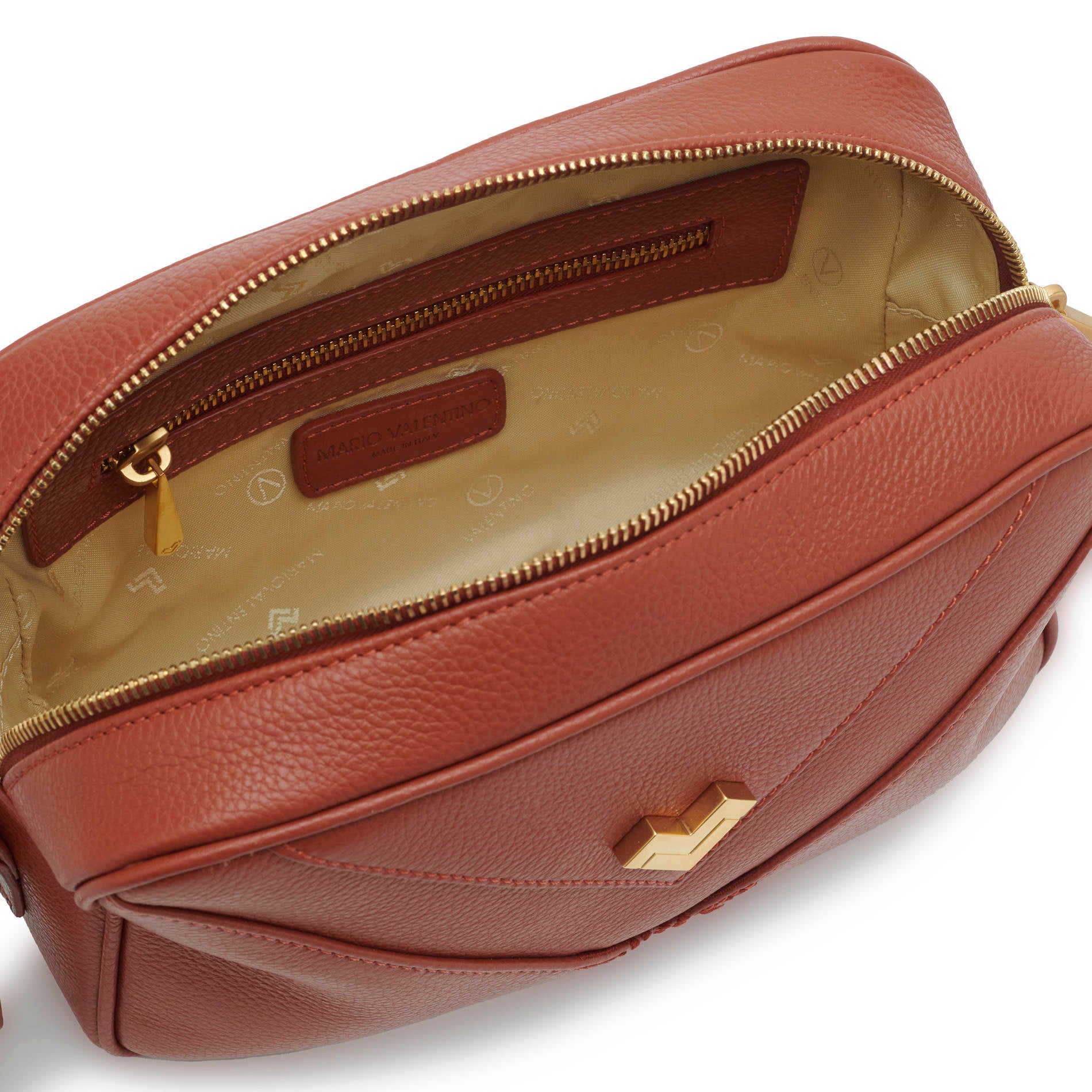 Interior rust crossbody bag with zip closure and organized space