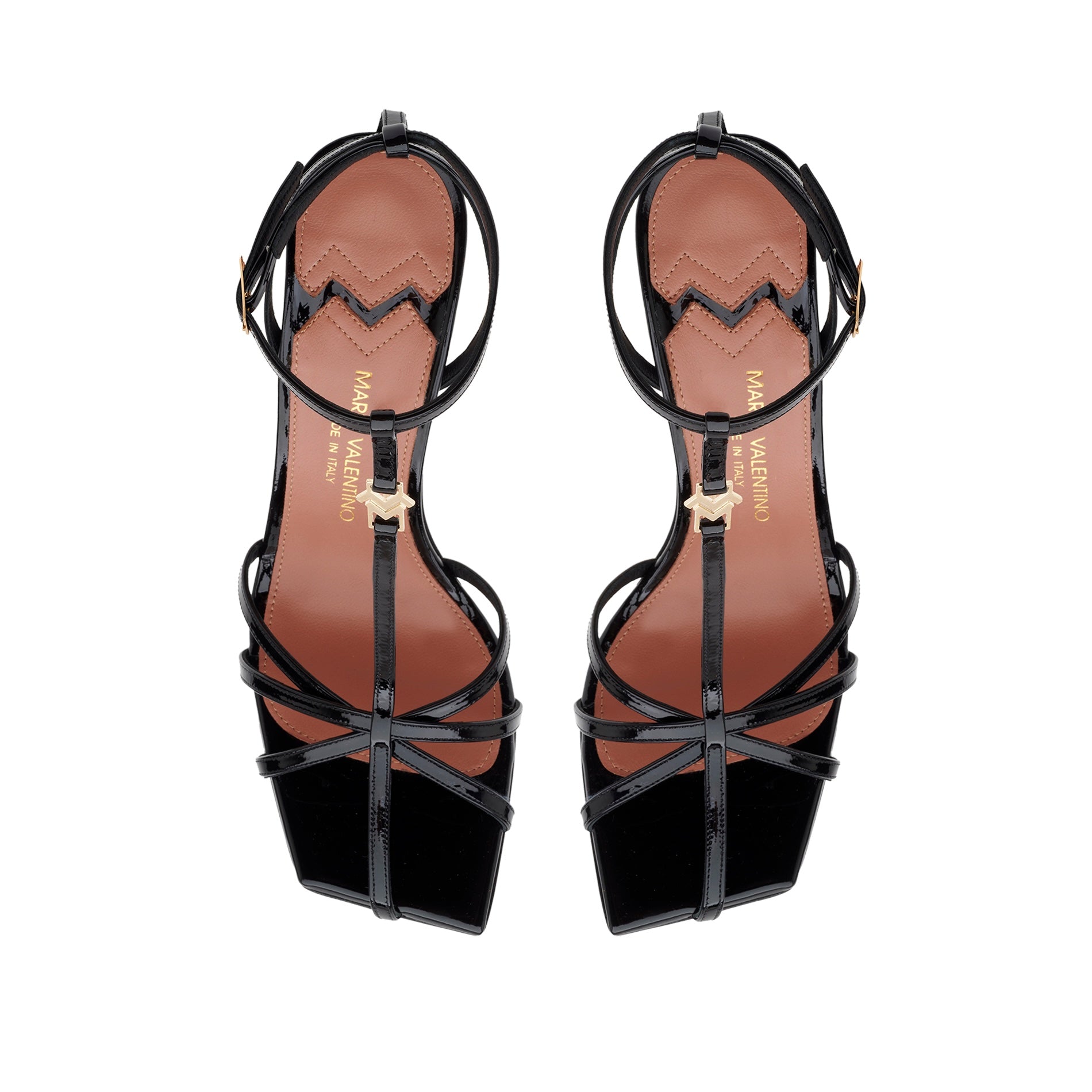 Top-down view of the Valerie T-bar sandal in black patent leather, highlighting the square toe and the contrasting golden MV accessory.