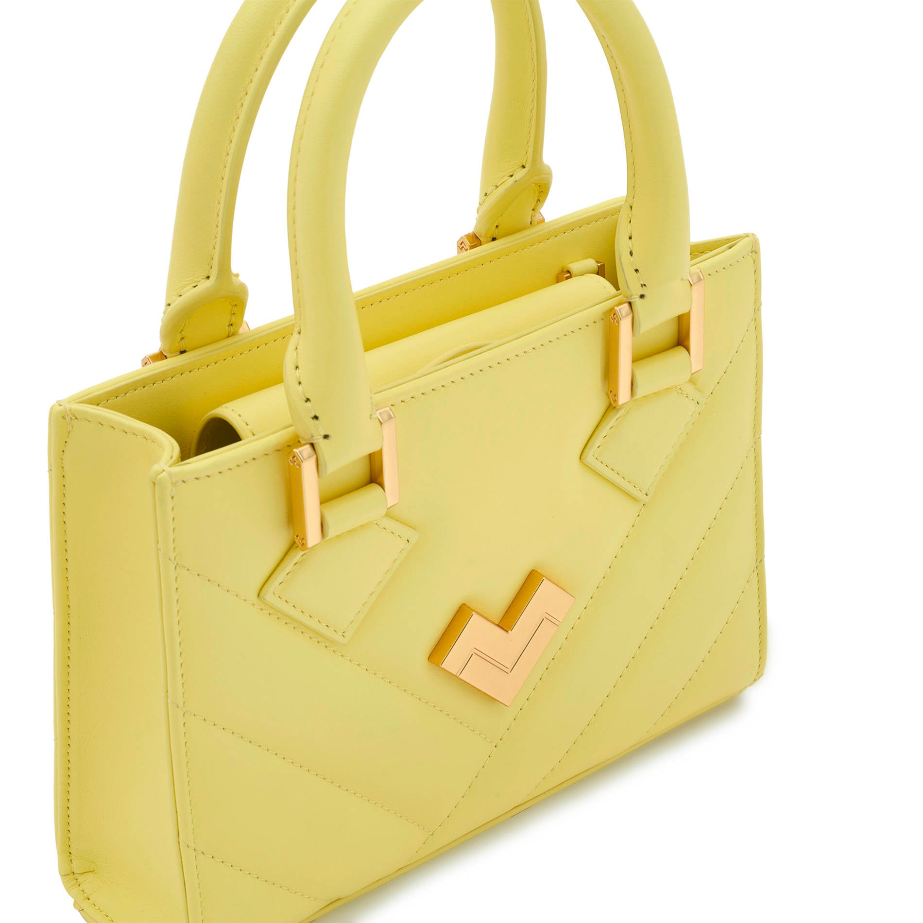 Close-up yellow quilted leather crossbody bag with gold-tone logo, hardware and stitching detail, compact Mario Valentino handbag. Made in Italy