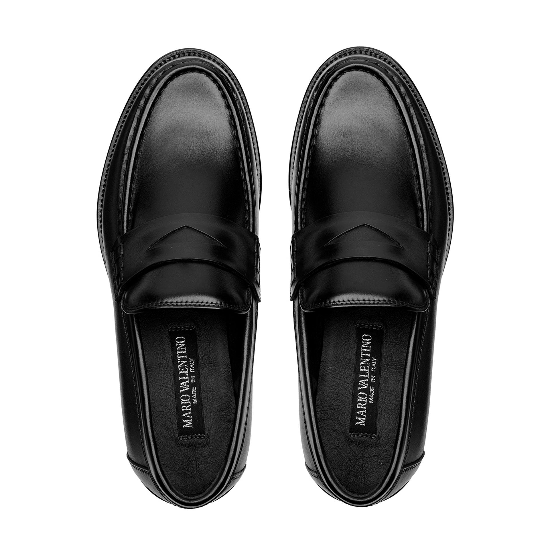Top-down view of black penny loafer highlighting the gimped vamp and polished calfskin upper