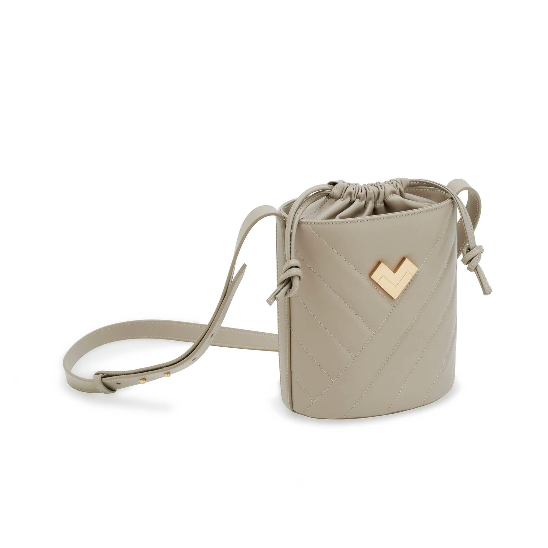 Grey quilted leather crossbody bucket bag with gold-tone logo, chevron stitching and leather drawstring detail.