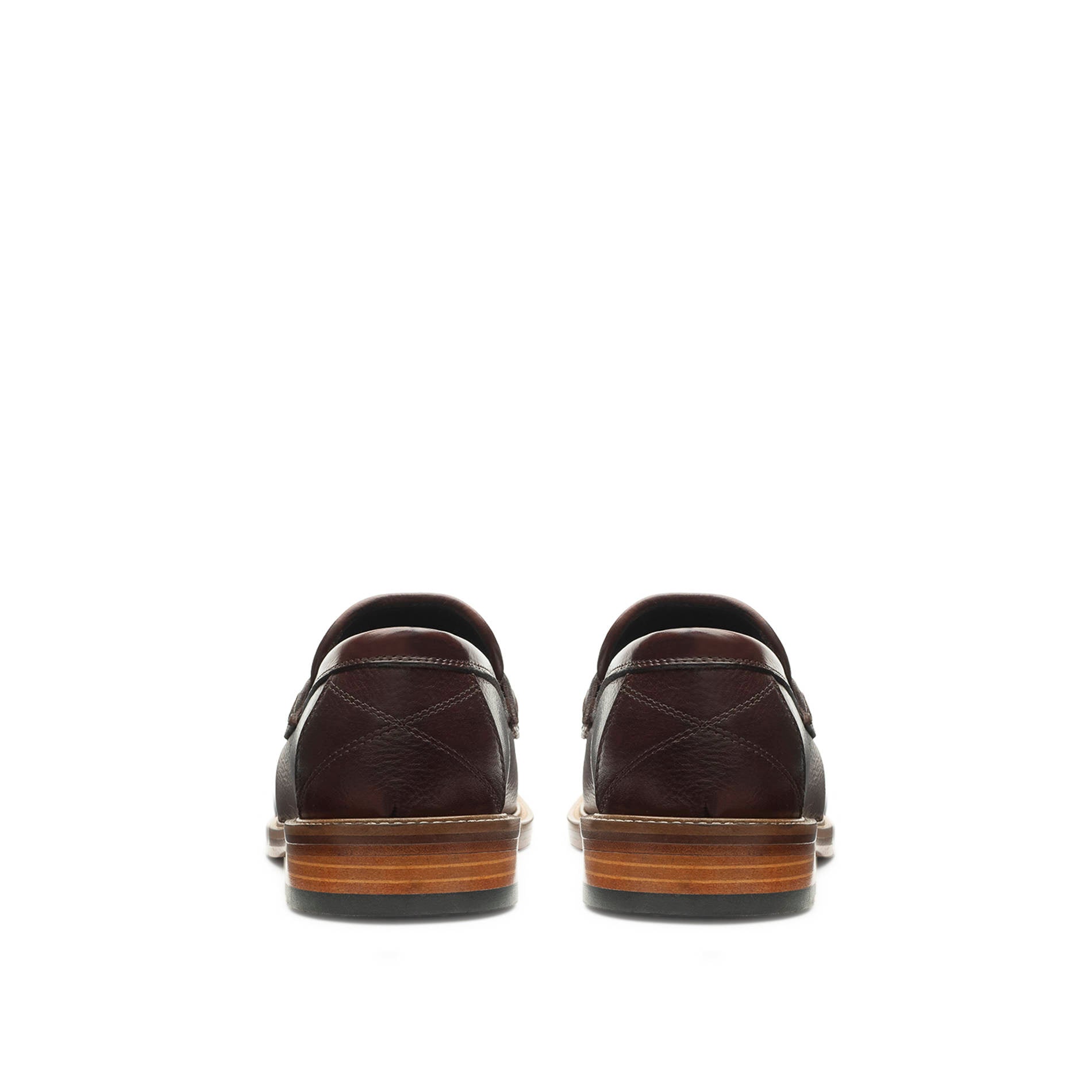 Rear view showing the stacked heel and finish of Mario Valentino loafers