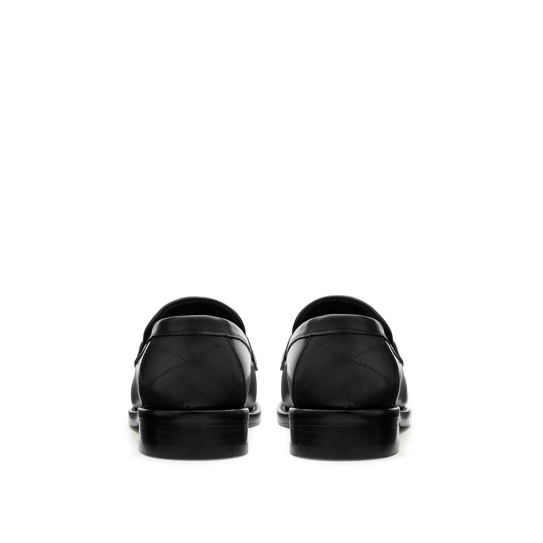 Back view Mario Valentino black leather loafers with structured heel