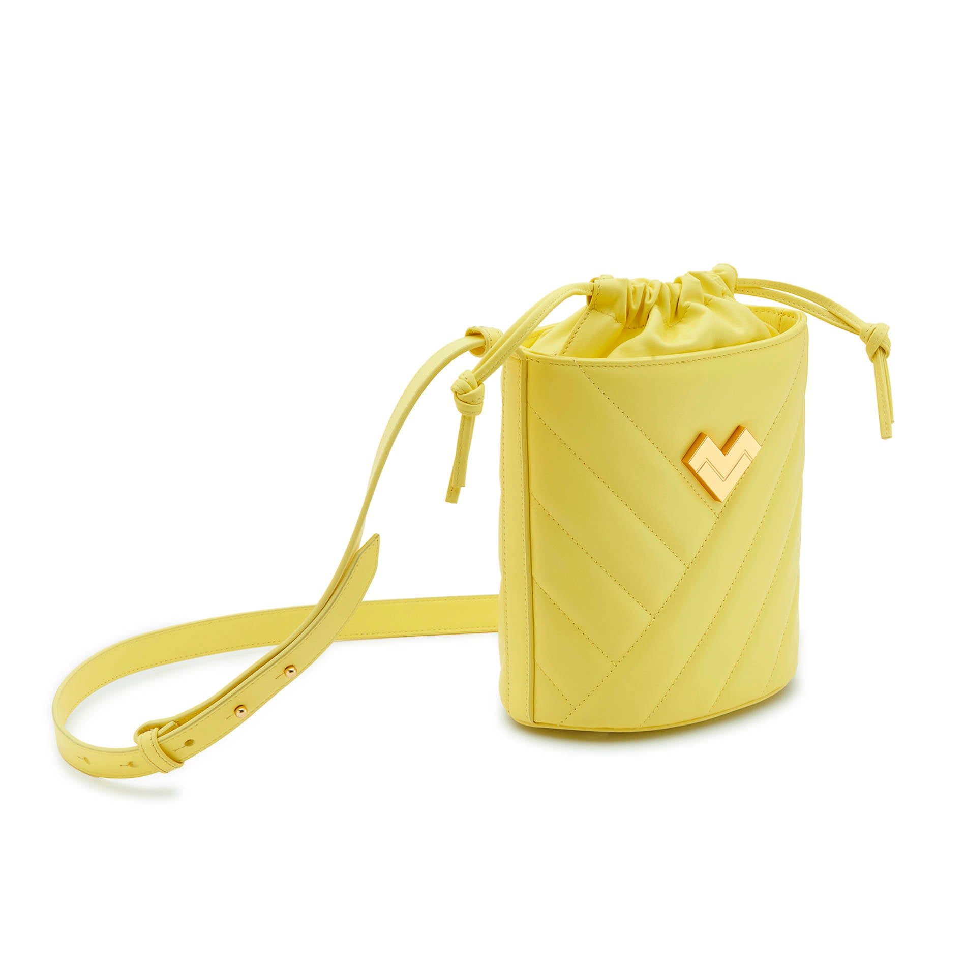 Yellow quilted leather crossbody bucket bag with gold-tone logo, chevron stitching and leather drawstring detail.