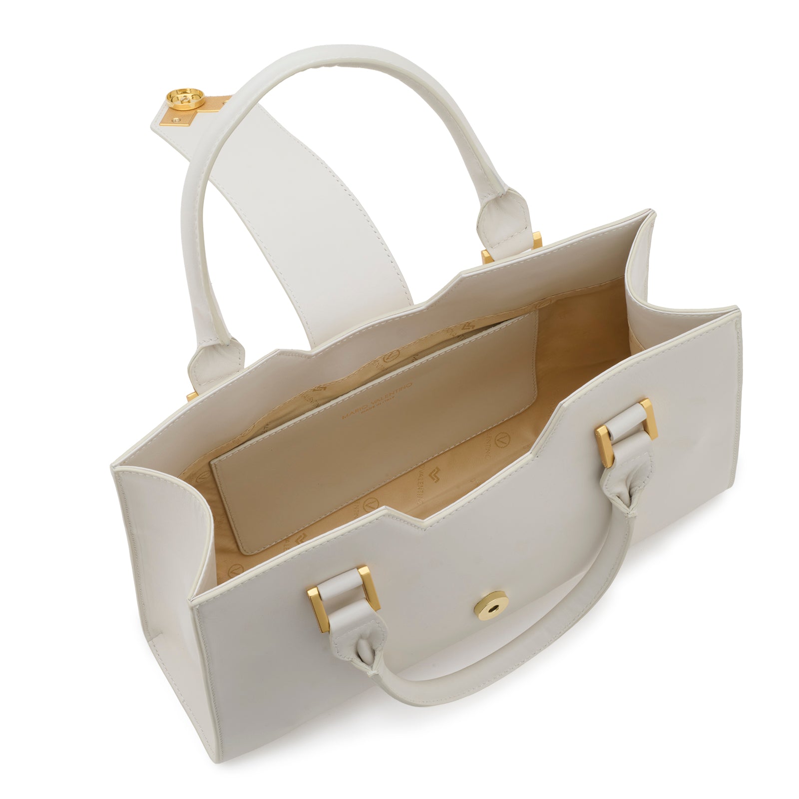 Interior view of the Mario Valentino white trapezoid tote, showcasing the signature logoed nylon lining, a functional internal slip pocket with gold-stamped branding, and the spacious structured compartment.