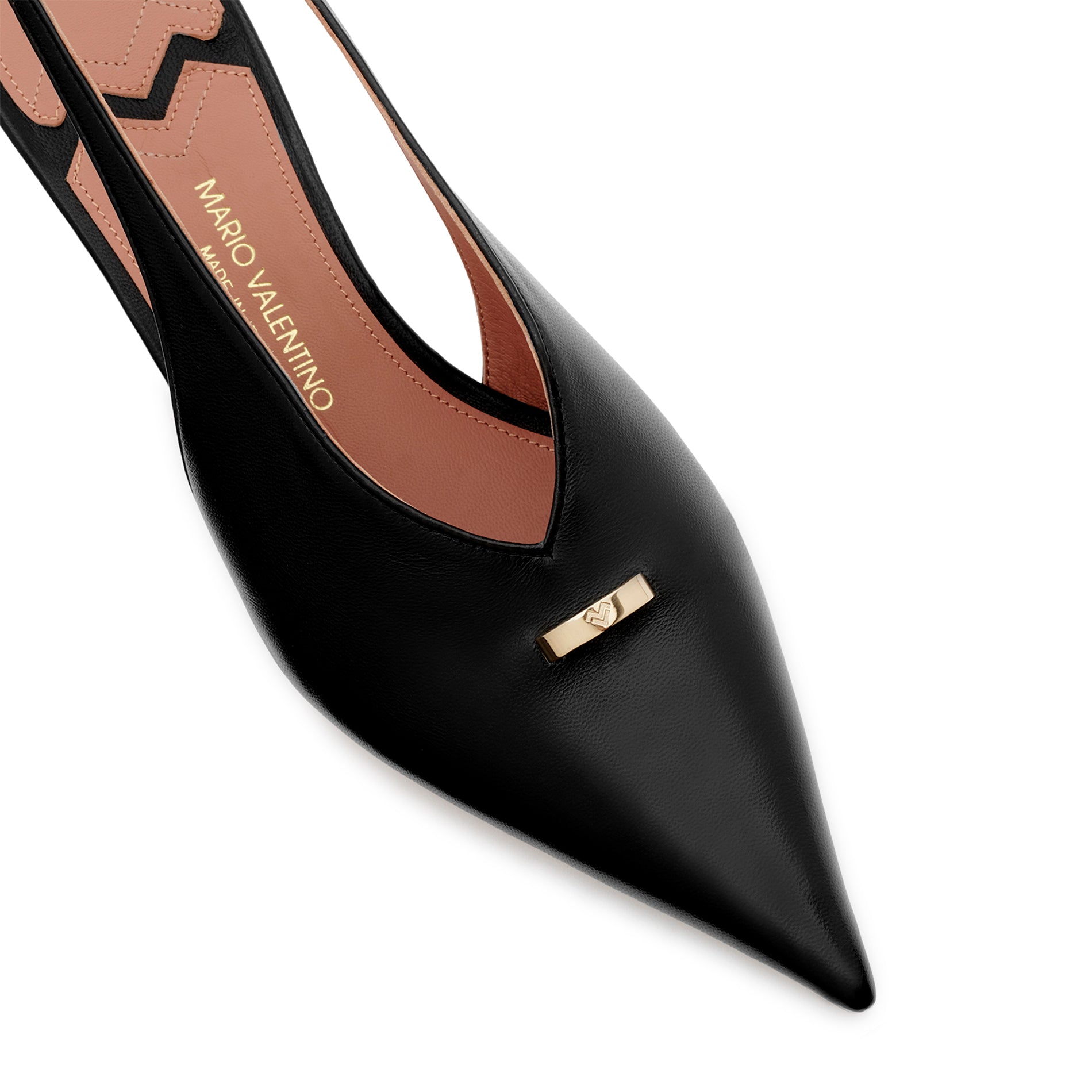 Detailed view of the gold logo ring accessory on Mario Valentino black leather slingback pumps.