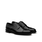 Black calfskin Oxford brogue shoes side view with leather sole