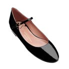 Detail of black patent leather ballet flats with smooth glossy finish