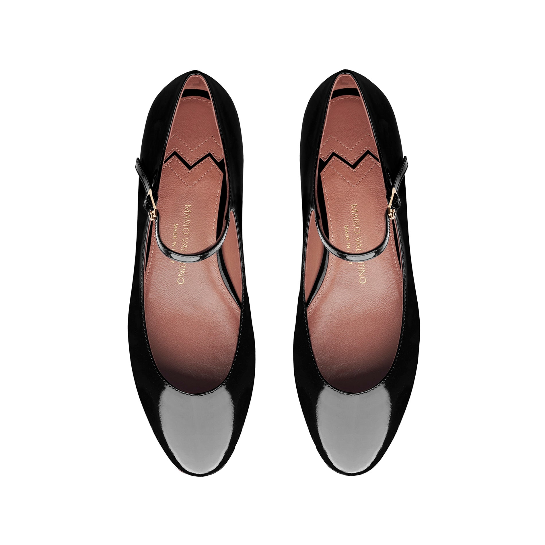 Top view of black patent leather ballet flats with strap and rounded toe