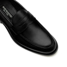 Detail of apron toe black calf leather penny loafers stitching