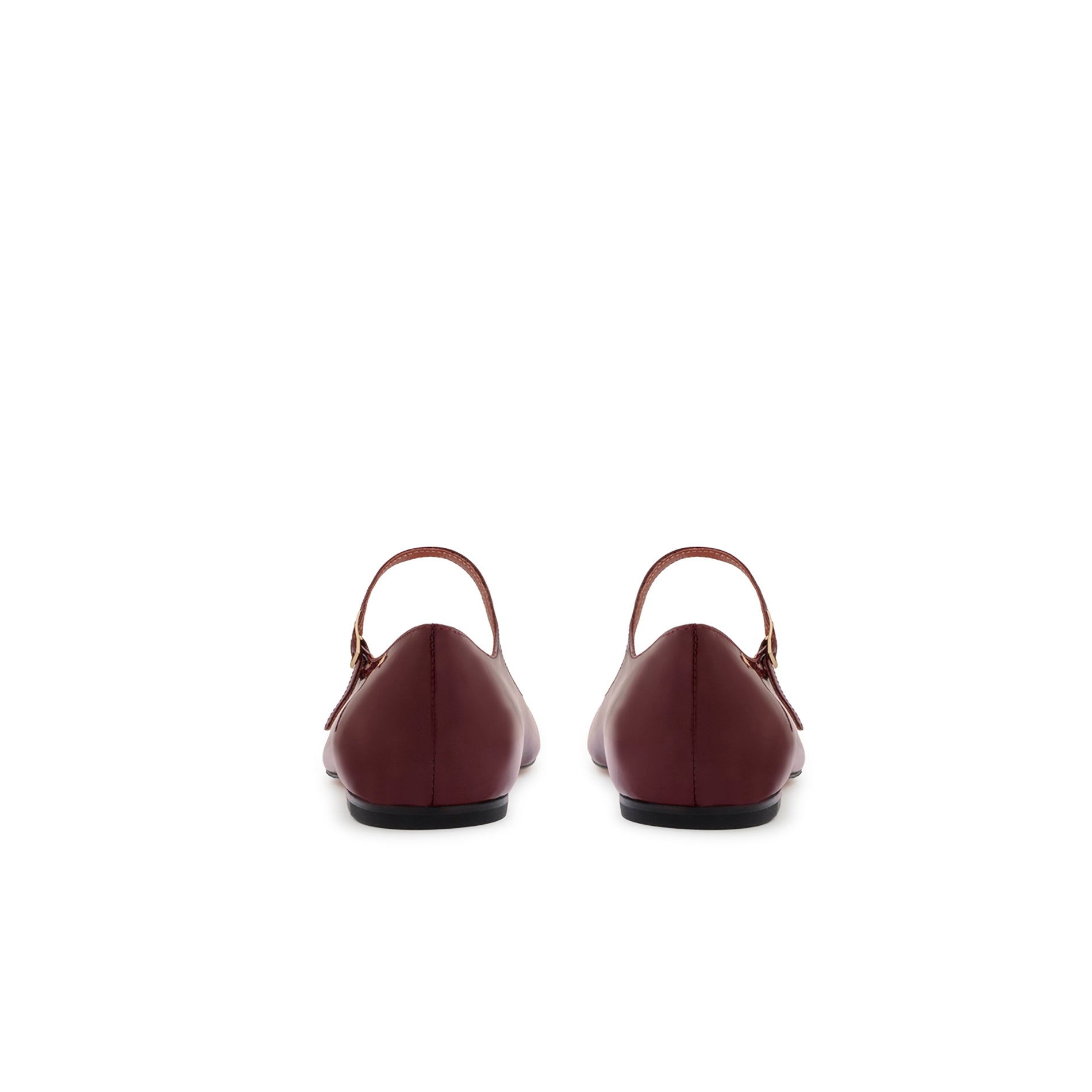 Rear view of burgundy patent ballet flats featuring a minimal silhouette and flat leather sole.