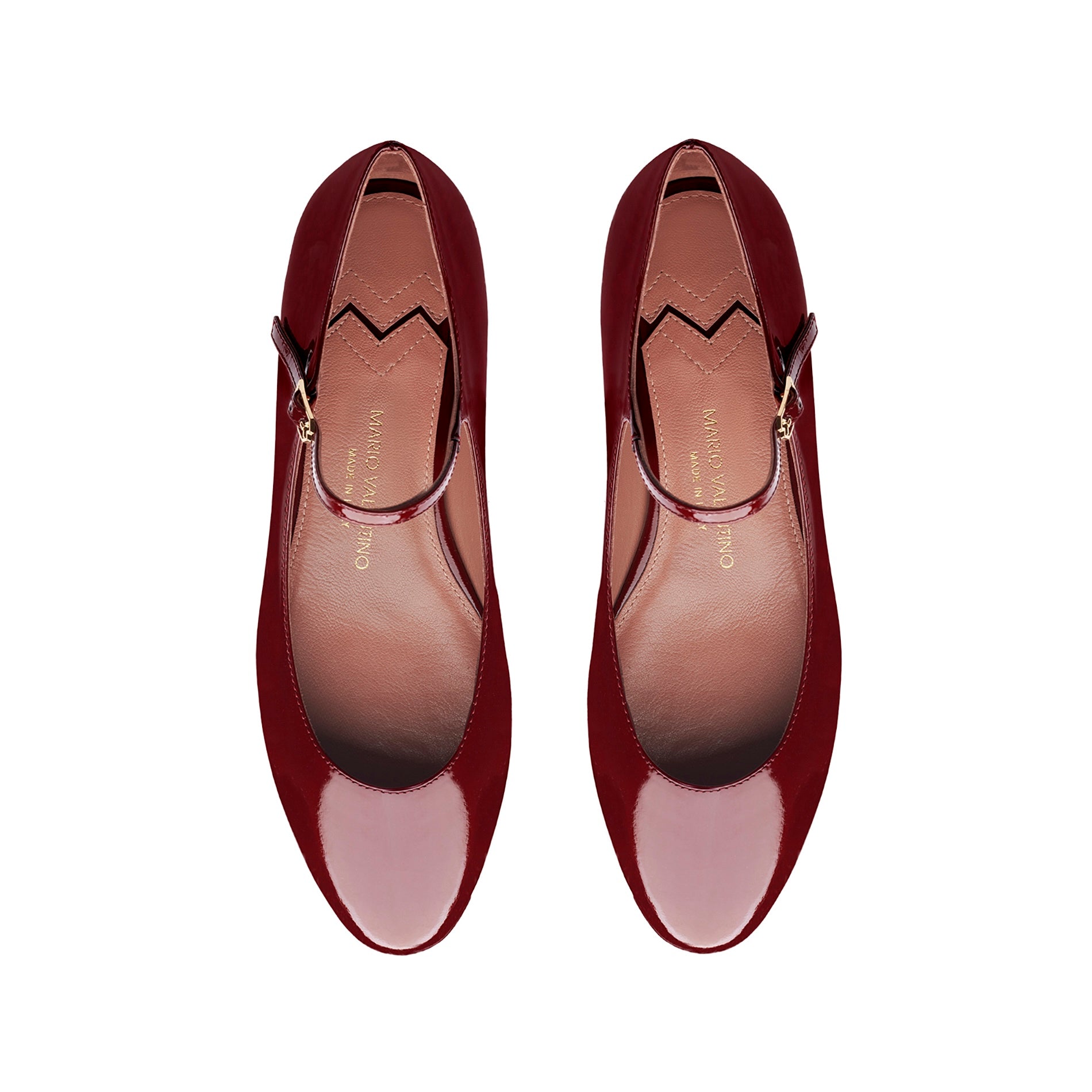 Top view of burgundy patent leather ballet flats with strap and rounded toe