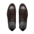 Top view of dark brown Oxford brogue shoes with closed lacing