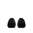 Back view black leather penny loafers with structured heel