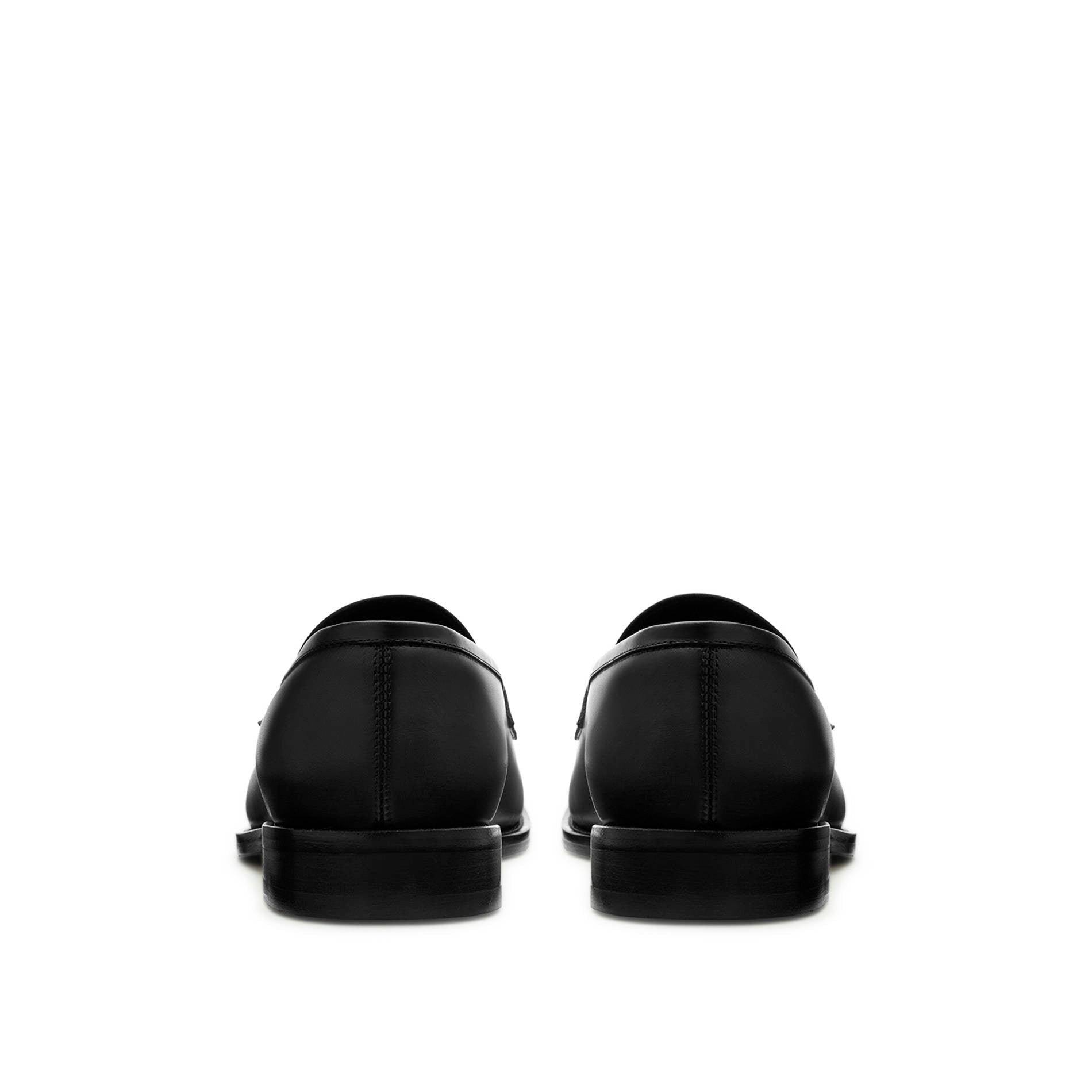 Back view black leather penny loafers with structured heel