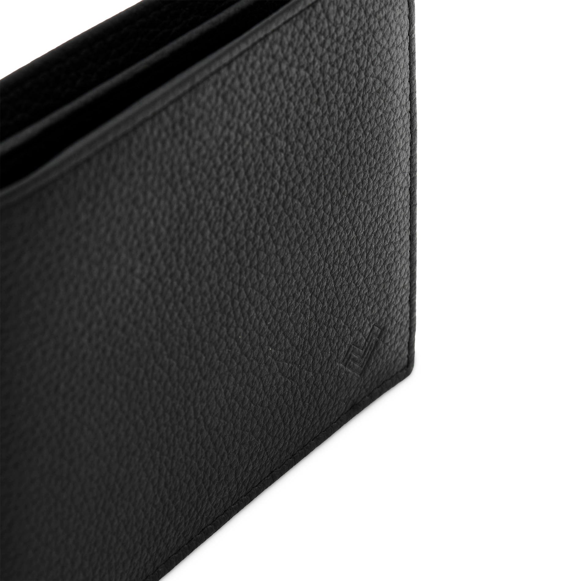Detail of Mario Valentino black grained leather wallet with embossed MV logo and textured finish.