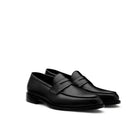 Black leather penny loafers 3/4 angle view Italian craftsmanship