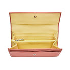 Interior of Mario Valentino envelope wallet featuring pale yellow leather lining, zip coin pocket, card slots and structured compartments