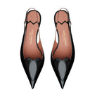 Mario Valentino black patent leather slingback pumps with pointed toe silhouette, refined torchon heels and adjustable strap. Iconic MV logo detail. Made in Italy.