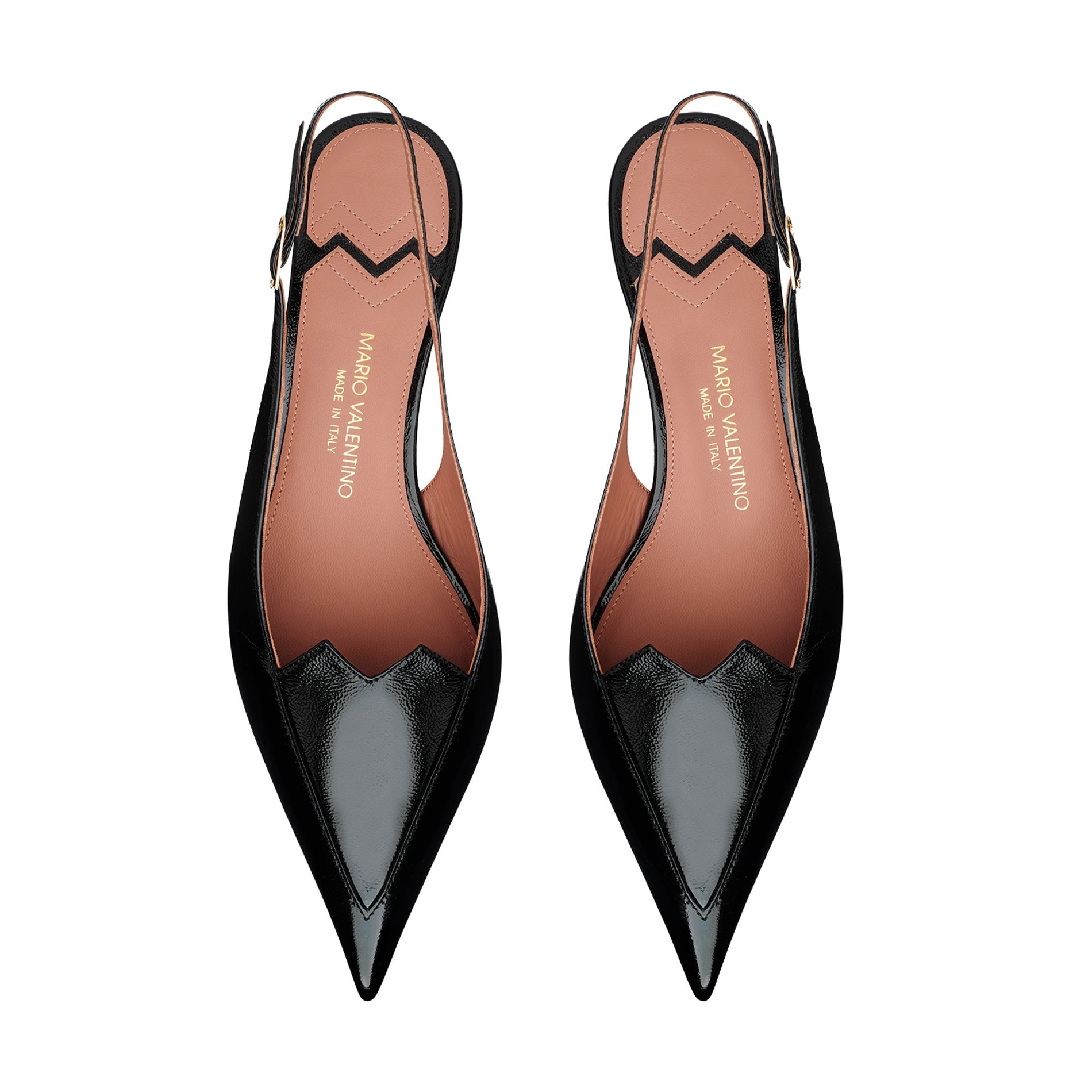 Mario Valentino black patent leather slingback pumps with pointed toe silhouette, refined torchon heels and adjustable strap. Iconic MV logo detail. Made in Italy.