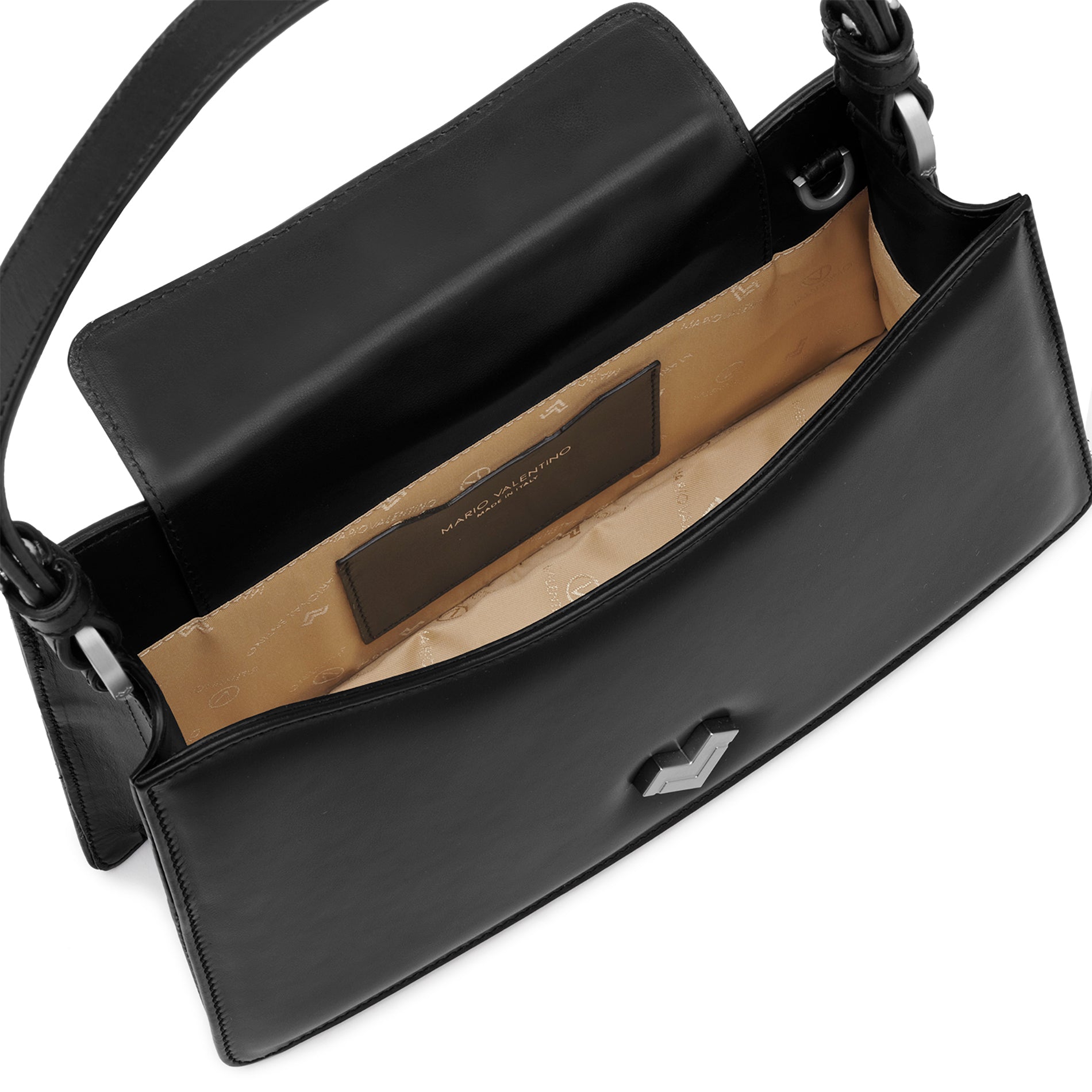 Interior detail of black leather bag with logoed lining and leather pocket.