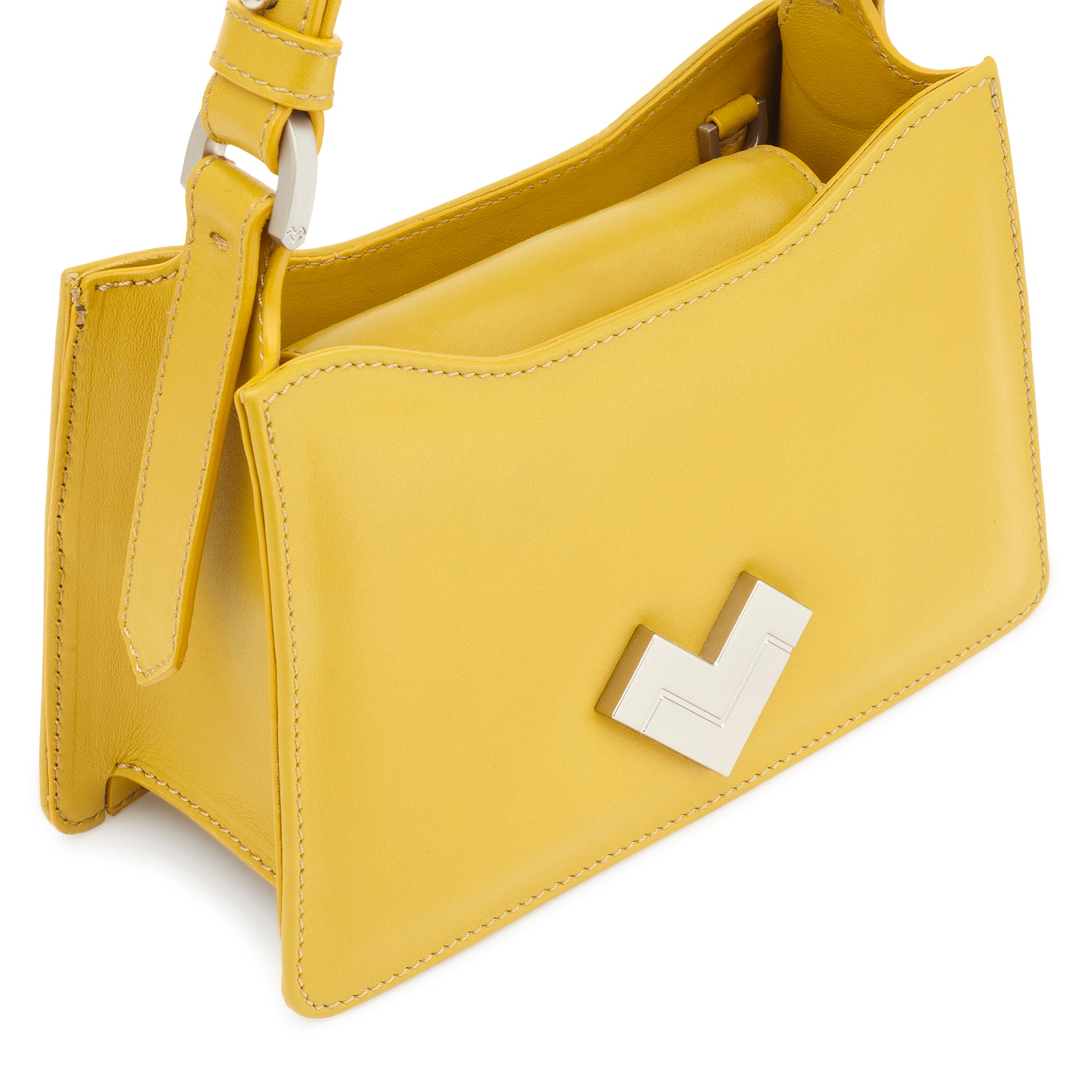Close-up of the yellow leather handle with silver-tone metal hardware on a structured mini bag.