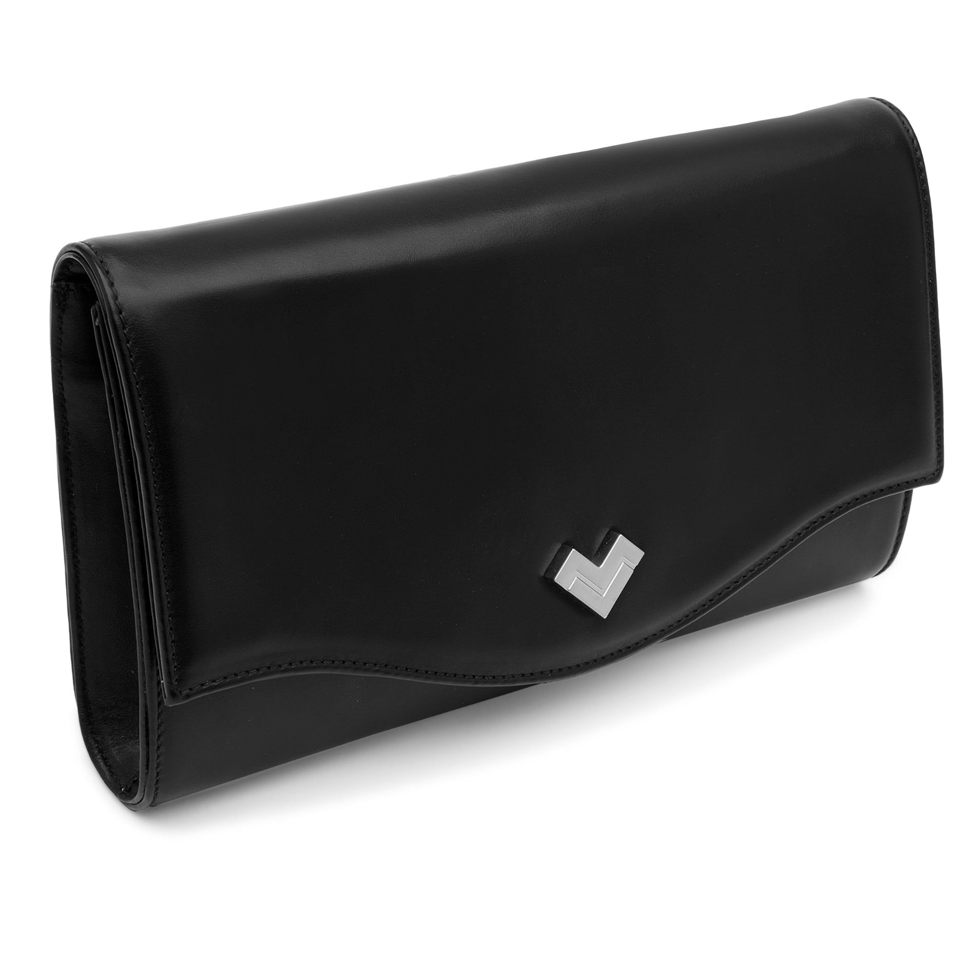 Close-up of the silver-tone MV logo detail on the curved flap of a black leather clutch bag.
