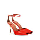 Mario Valentino Kara coral red leather open-toe sandals with gold-tone Clepsydra heel and adjustable ankle strap, crafted in Italy.