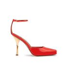 Side view of Mario Valentino sandal in coral red patent leather with square toe, open-work detail and 95 mm gold Clepsydra hourglass heel