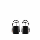 Mario Valentino black slingback with adjustable ankle strap and gold buckle, back view