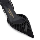 Black kidskin and mesh slingback pumps, pointed toe, and the iconic embossed logo on the leather sole. Italian craftsmanship.