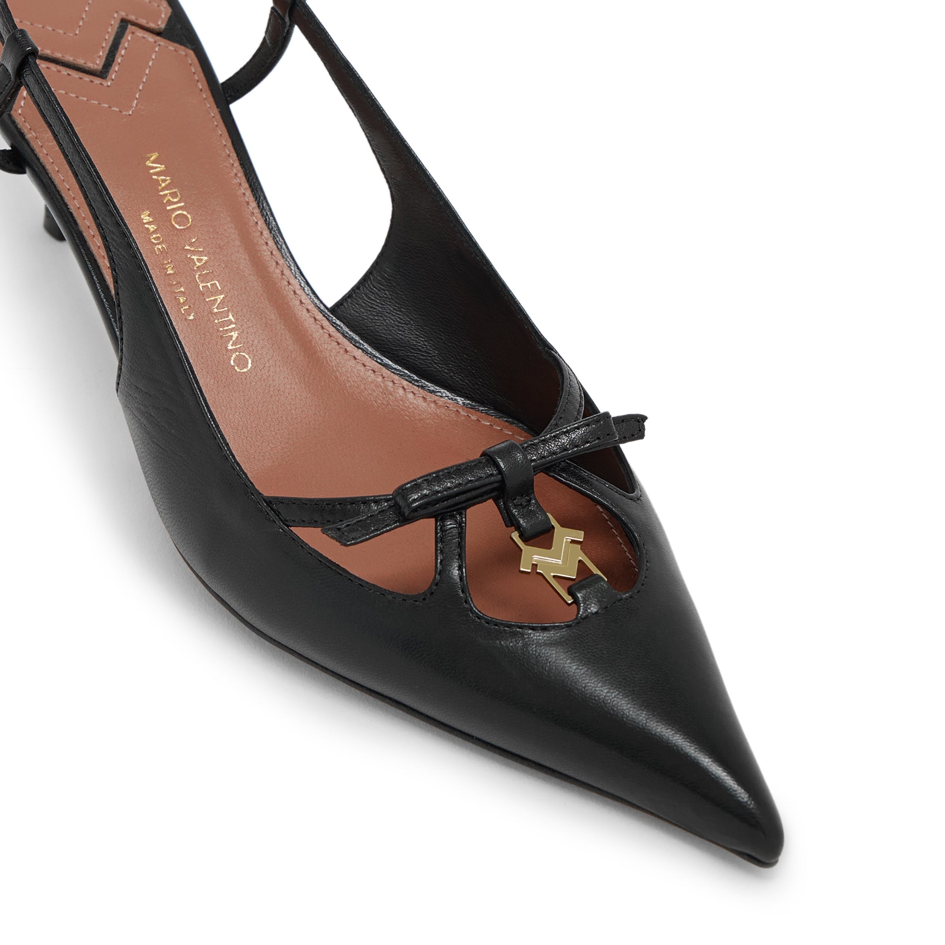 Close-up of leather bow detail and gold MV logo on Mario Valentino Cindy black leather pointed toe slingback