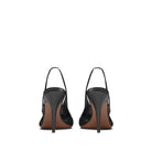 Mario Valentino black leather slingback pumps with slim stiletto heel and elastic slingback strap, back view.