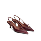 Mario Valentino Cindy burgundy kidskin leather slingback with kitten heel, pointed toe, bow detail and gold MV logo, three-quarter view