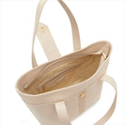 Powder leather tote bag interior with zip closure, inner pocket and logo lining