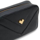 Gold logo detail on black leather mini crossbody bag with premium craftsmanship Made in Italy