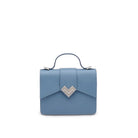 Front view of light blue leather mini top handle bag with silver MV logo and structured silhouette