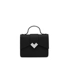 Front view of mini top handle bag in black calf leather with gold-tone MV logo and structured silhouette