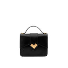 Front view of mini top handle bag in black calf leather with gold-tone MV logo and structured silhouette