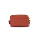 Rust leather crossbody bag back view with minimalist design and compact silhouette Made in Italy