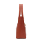 Rust calf leather shoulder bag side detail with clean lines and structured design. Made in Italy