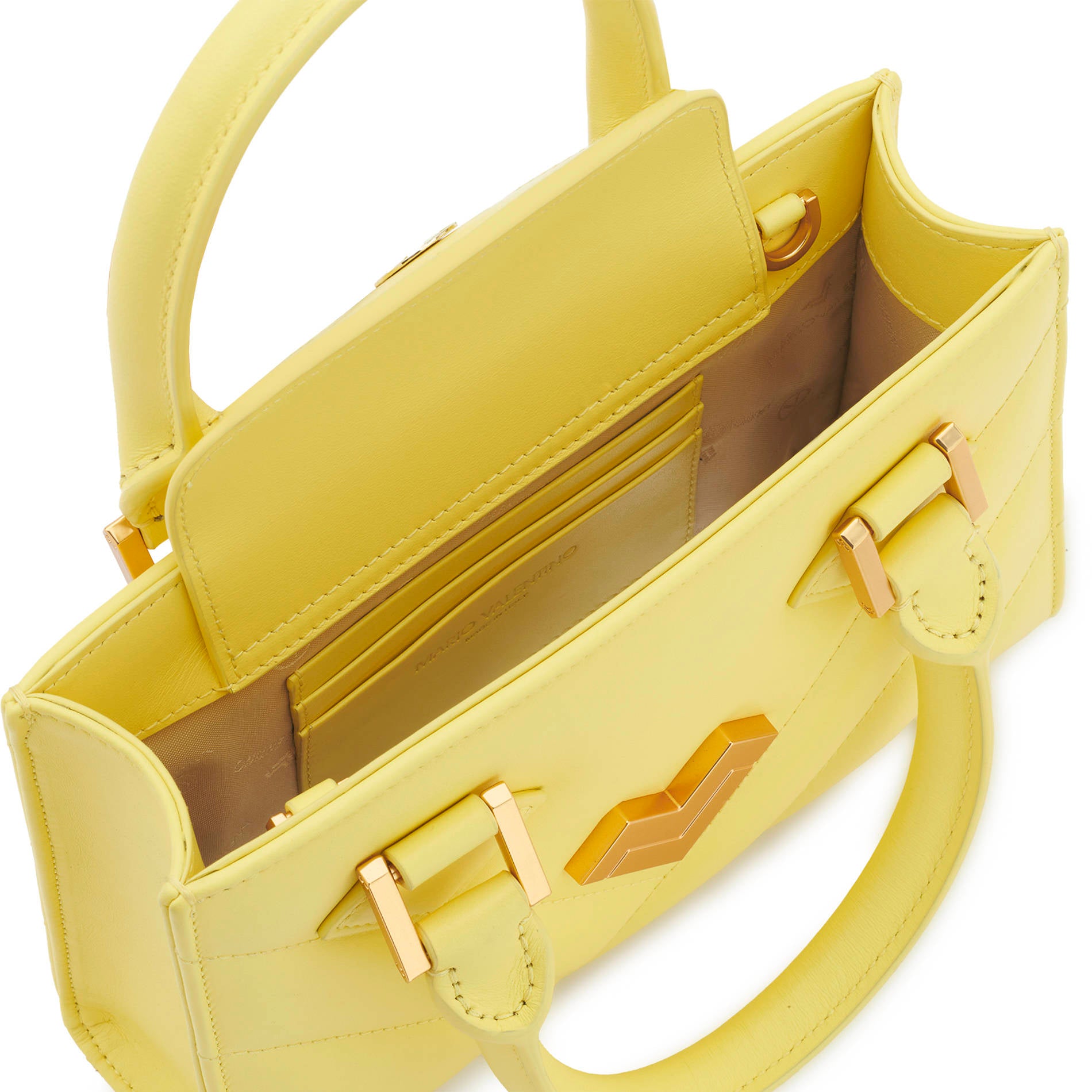 Yellow leather crossbody bag interior with magnetic closure, refined lining and card slots.