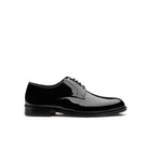 Black patent leather men's derby shoes with high-gloss finish and lace-up closure — lateral view, made in Italy