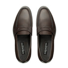 Top view of brown leather penny loafers with saddle strap