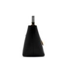 Side profile of the structured Mario Valentino black leather bag highlighting the 15cm depth and gold-finish accents