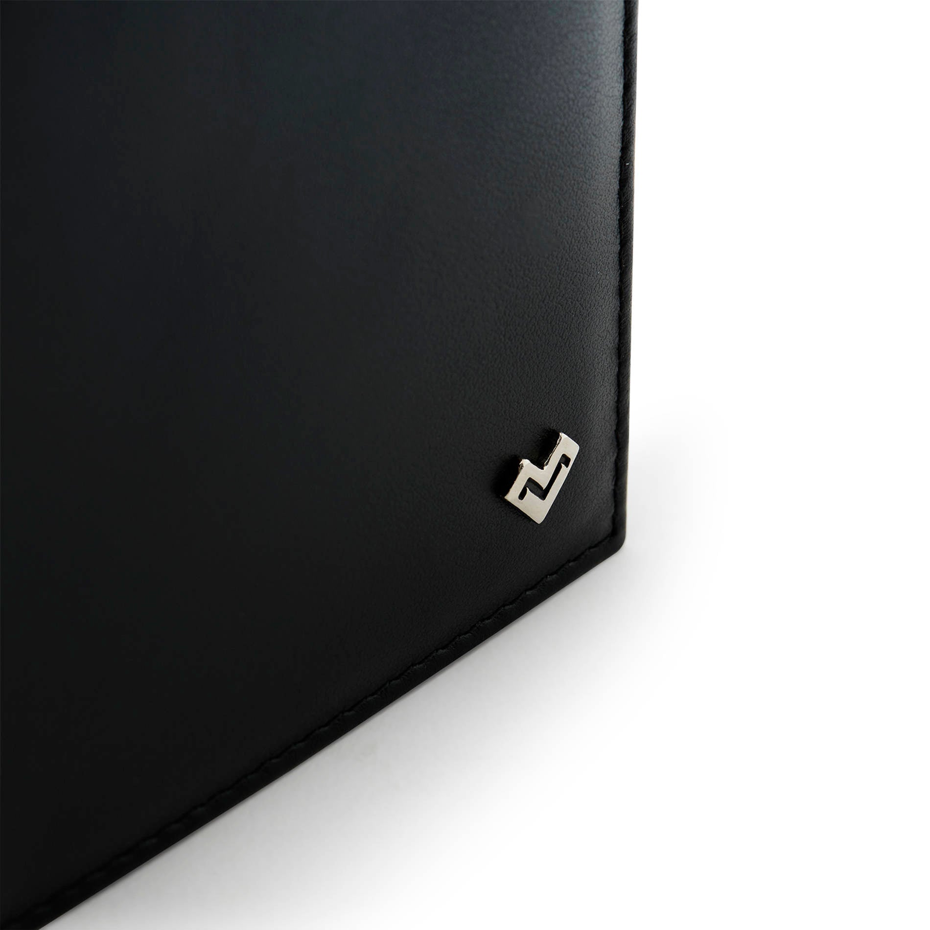 Detail of Mario Valentino black Italian embossed calfskin leather wallet with metal MV logo and smooth finish.